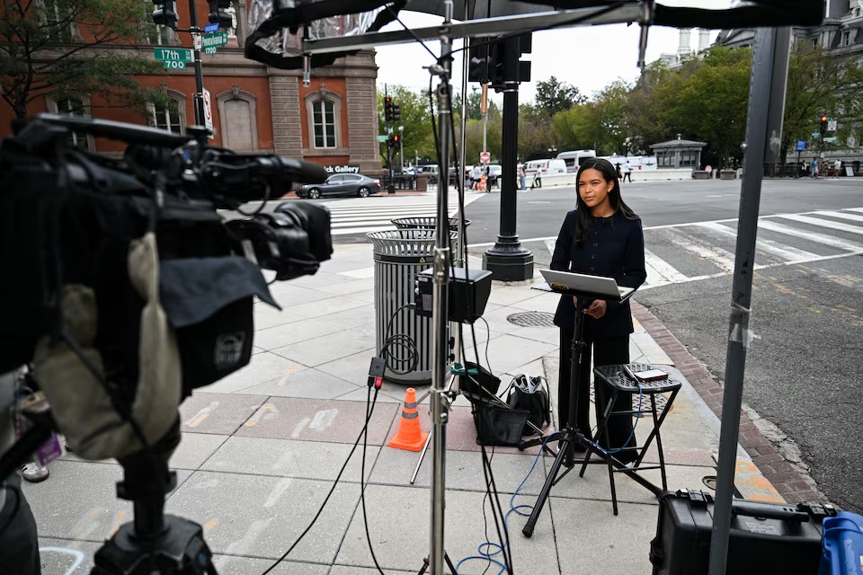 MS Now correspondent Akayla Gardner reports outside the White House grounds after President Donald Trump banned MS Now, CNN, and Politico in a Truth Social post, in Washington, D.C., US, September 20, 2026. REUTERS/Annabelle Gordon