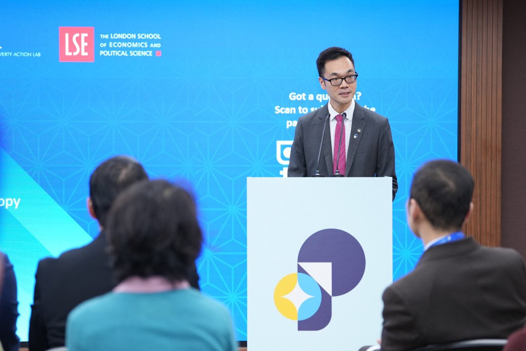 Brian San, Secretary-General, Institute of Philanthropy, delivers a speech on stage.