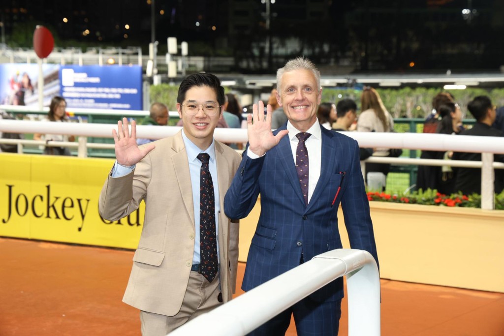 Mark Newnham (right) and assistant Henry Wong celebrate five wins at Happy Valley. Sing Tao