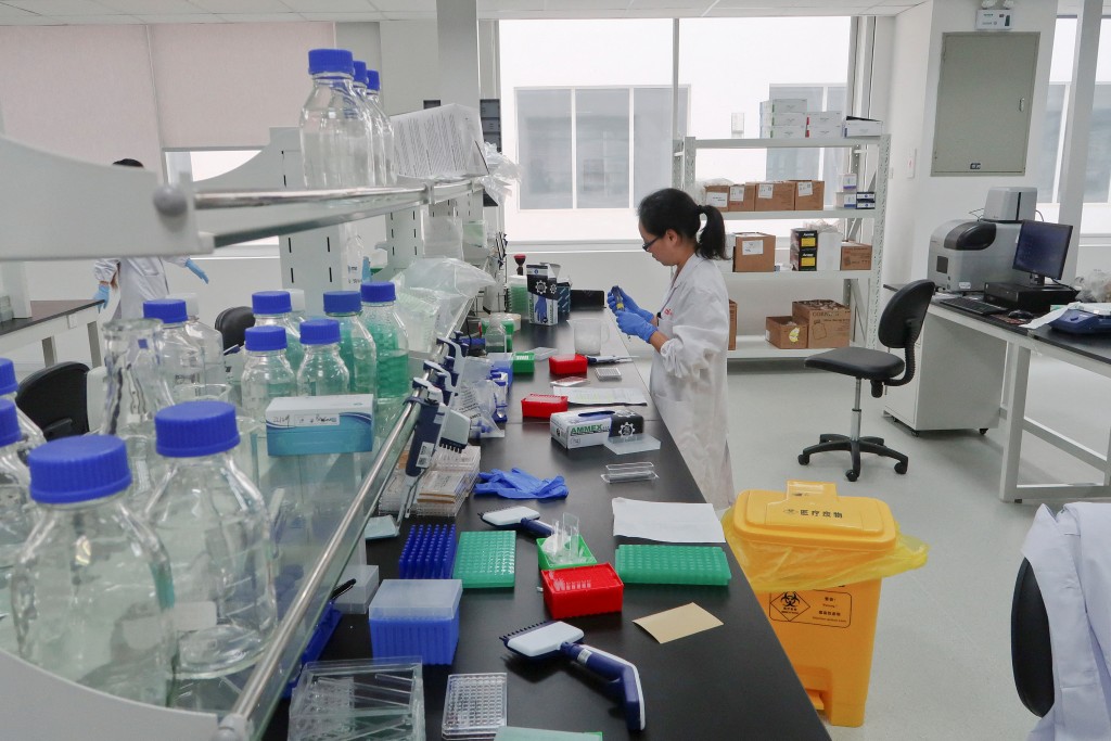 A scientist works at Zai Labo's drug development facility in Shanghai, China October 18, 2017. To match Insight CHINA-BIOTECH/ REUTERS/Adam Jourdan