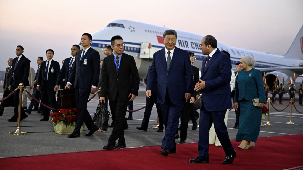 China's President Xi Jinping walks with his his Egyptian counterpart Abdel Fattah al-Sisi. Reuters