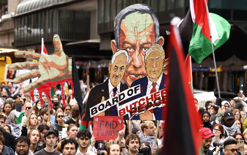 Protesters hold images of Israeli Prime Minister Benjamin Netanyahu and US President Donald Trump during a demonstration on the day of Netanyahu's address to the 81st United Nations General Assembly in New York, on September 24, 2026. (Photo by CHARLY TRIBALLEAU / AFP)
