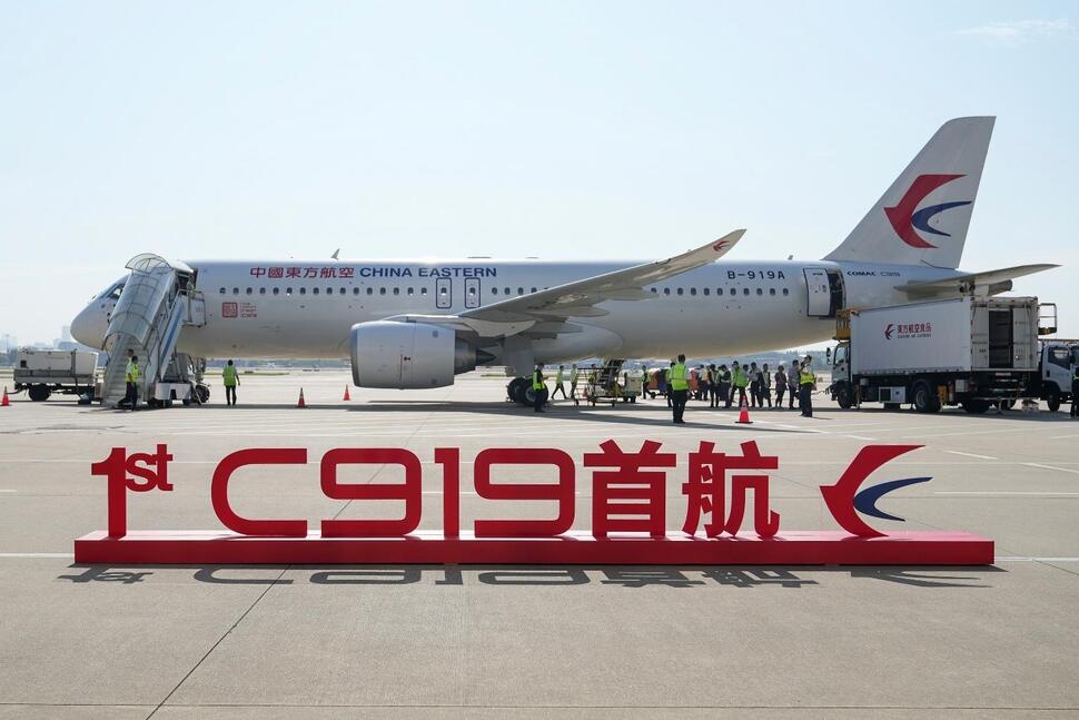 FILE - In this photo released by Xinhua News Agency, a sign which reads '1st C919 inaugural flight' is seen in front of the Chinese made passenger aircraft prepared for its first commercial flight from Shanghai on Sunday, May 28, 2023. A Chinese C919 jet arrived in Hong Kong on Tuesday, Dec. 12, 2023, in the Chinese-made plane's first foray outside of mainland China as its manufacturer prepares to take on Airbus and Boeing in the market for single-aisle commercial aircraft. (Ding Ting/Xinhua via AP, File) FILE - In this photo released by Xinhua News Agency, a sign which reads '1st C919 inaugural flight' is seen in front of the Chinese made passenger aircraft prepared for its first commercial flight from Shanghai on Sunday, May 28, 2023. A Chinese C919 jet arrived in Hong Kong on Tuesday, Dec. 12, 2023, in the Chinese-made plane's first foray outside of mainland China as its manufacturer prepares to take on Airbus and Boeing in the market for single-aisle commercial aircraft. (Ding Ting/Xinhua via AP, File)