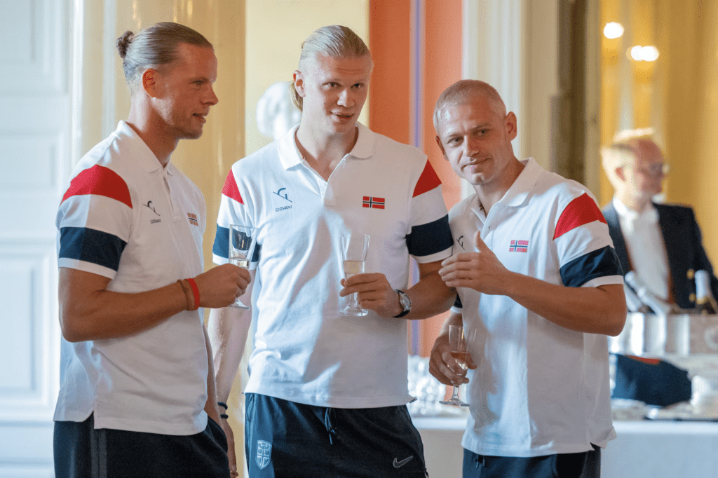 Orjan Haskjold Nyland and Erling Braut Haaland react during a reception by the royal family at the palace for Norway's national football team, in Oslo, Norway, July 13, 2026. (Jan Langhaug /NTB/via REUTERS)