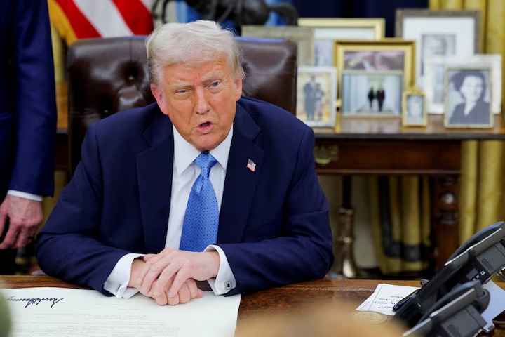 U.S. President Donald Trump looks on as he signs an executive order in the Oval Office at the White House in Washington, U.S., January 31, 2025. REUTERS/Carlos Barria U.S. President Donald Trump looks on as he signs an executive order in the Oval Office at the White House in Washington, U.S., January 31, 2025. REUTERS/Carlos Barria
