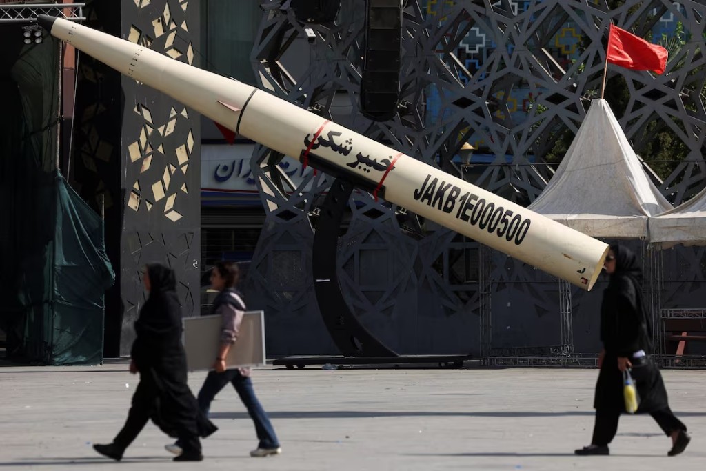  People walk next to a symbolic mockup of an Iranian missile at Imam Hussein Square in Tehran, Iran, July 12, 2026. Majid Asgaripour/WANA (West Asia News Agency) via REUTERS