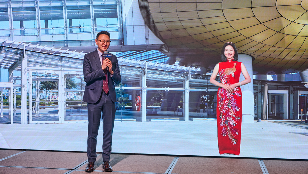 Standing next to Daniel Seah, CEO of Digital Domain, is the late renowned singer Teresa Teng Li-Chun, whose presence is brought back to the screen by Daniel's team through AI technology to greet the audience.