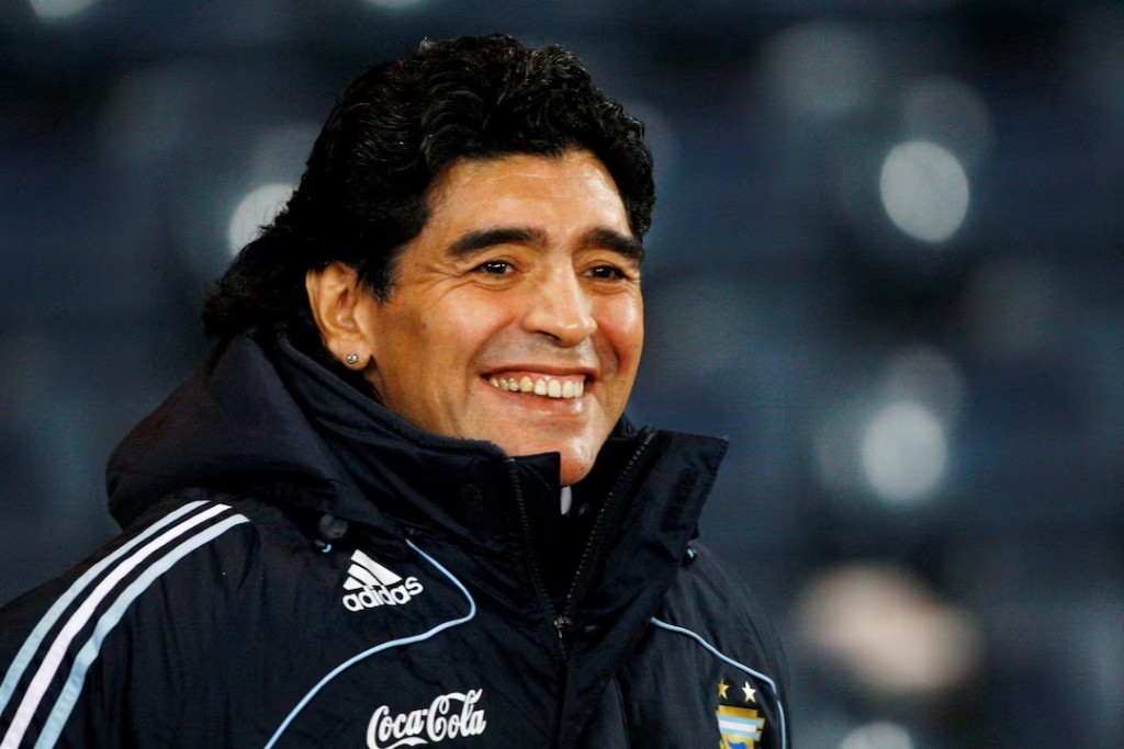 Argentina's soccer team head coach Diego Maradona smiles during their international friendly soccer match against Scotland at Hampden Park stadium in Glasgow, Scotland November 19, 2008. REUTERS/David Moir/File Photo 