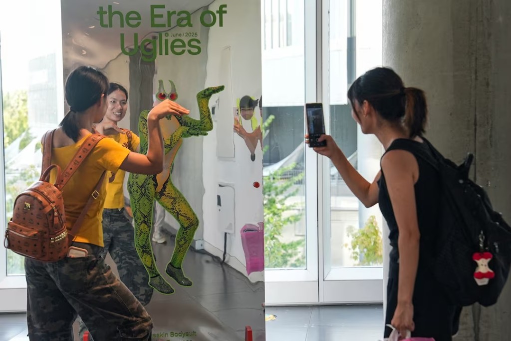  People visit the exhibition 'Era of Uglies Has Arrived' by Alibaba's Taobao, in Hangzhou, Zhejiang province, China August 13, 2025. REUTERS/Nicoco Chan 