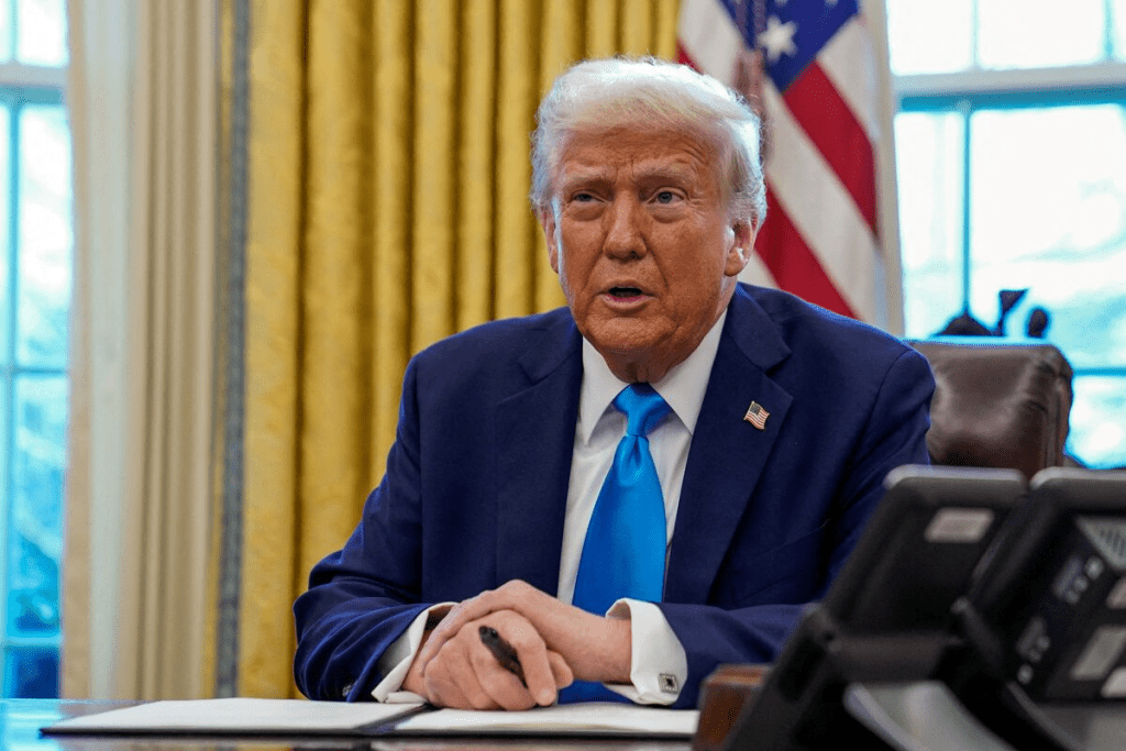 U.S. President Donald Trump speaks as he signs documents in the Oval Office at the White House in Washington, U.S. February 4, 2025. REUTERS/Elizabeth Frantz/File Photo