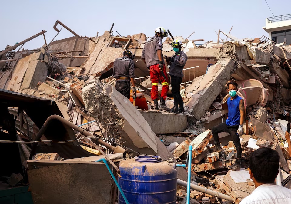 Rescuers work at the site of a building that collapsed, in the aftermath of a strong earthquake, in Mandalay, Myanmar, March 30. (Reuters) Rescuers work at the site of a building that collapsed, in the aftermath of a strong earthquake, in Mandalay, Myanmar, March 30. (Reuters)