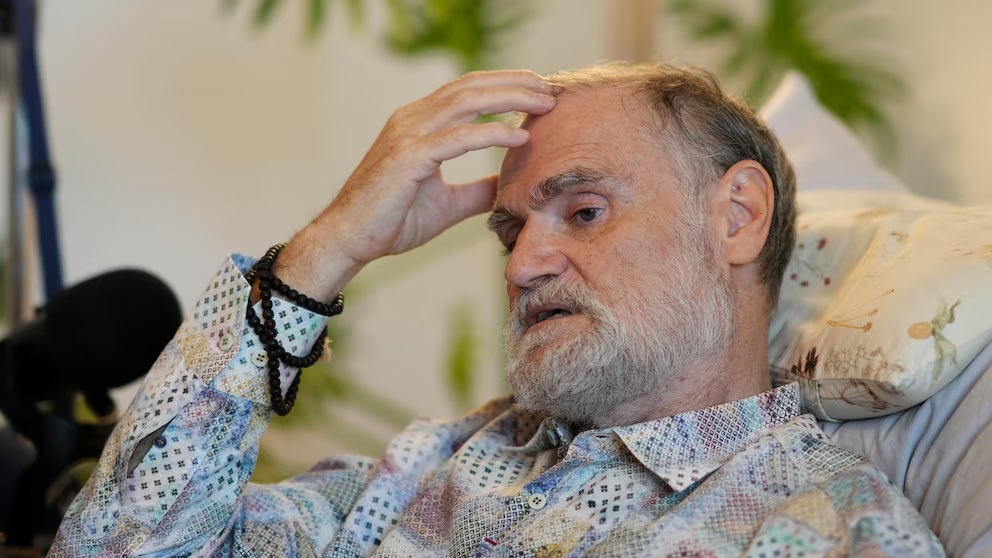 Michael Bommer, who is terminally ill with colon cancer, answers questions during a meeting with The Associated Press at his home in Berlin, Germany, Wednesday, May 22, 2024. Bommer, who has only a few more weeks to live, teamed up with friend who runs the AI-powered legacy platform Eternos to 'create a comprehensive, interactive AI version of himself, allowing relatives to engage with his life experiences and insights,' after he has passed away. (AP Photo/Markus Schreiber) Michael Bommer, who is terminally ill with colon cancer, answers questions during a meeting with The Associated Press at his home in Berlin, Germany, Wednesday, May 22, 2024. Bommer, who has only a few more weeks to live, teamed up with friend who runs the AI-powered legacy platform Eternos to 'create a comprehensive, interactive AI version of himself, allowing relatives to engage with his life experiences and insights,' after he has passed away. (AP Photo/Markus Schreiber)
