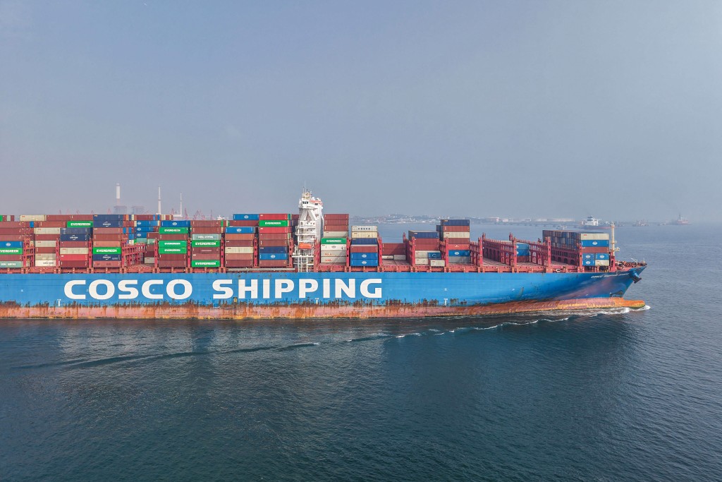 A container ship sails out of the port in Qingdao, in China's eastern Shandong province on August 7, 2025.  (Photo by AFP)