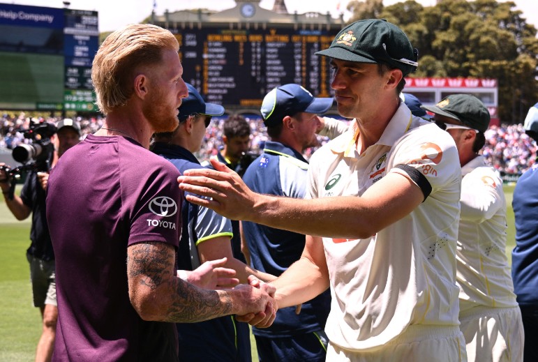 Australia captain Pat Cummins shakes hands with England's Ben Stokes. AFP 