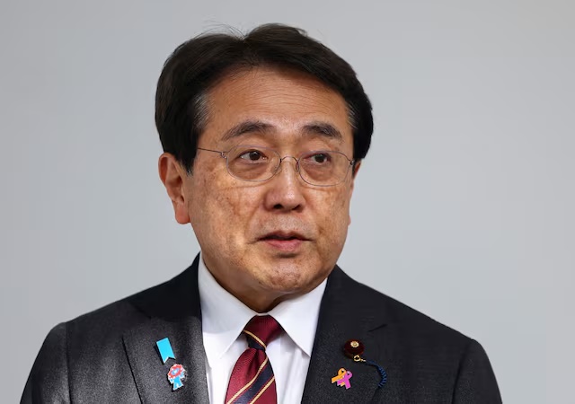 Japan's Economic Revitalization Minister Ryosei Akazawa speaks to the press upon his arrival at Haneda Airport, a day after ministerial talks on tariffs, with U.S. President Donald Trump joining the negotiators, in Tokyo, Japan, April 18, 2025. REUTERS/Issei Kato/File Photo