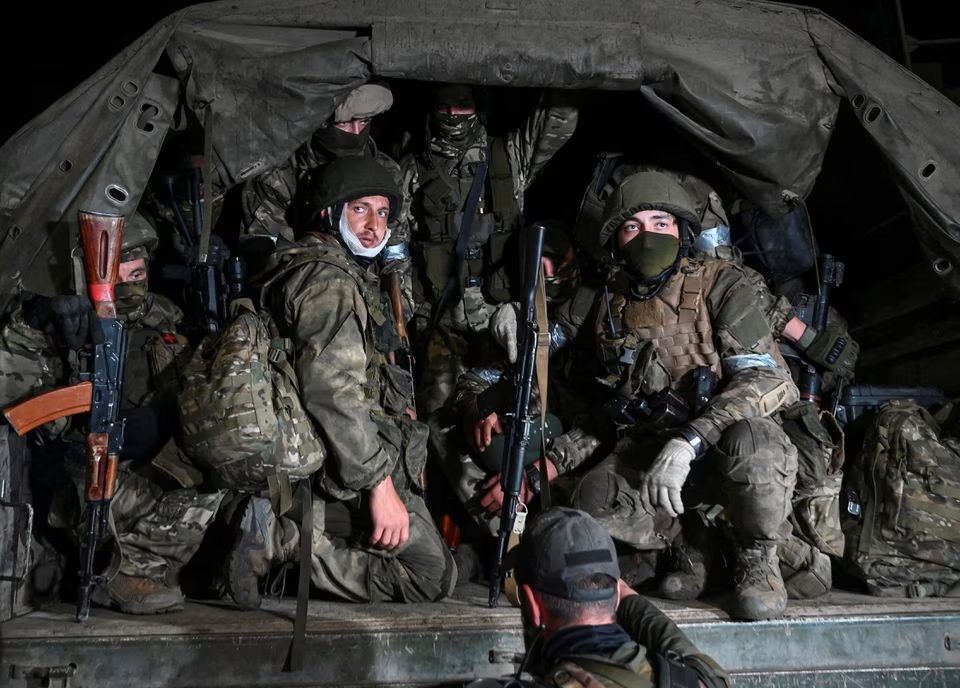 Fighters of Wagner private mercenary group, including Roman Yamalutdinov (L), pull out of the headquarters of the Southern Military District to return to base, in the city of Rostov-on-Don, Russia, June 24. (Reuters) Fighters of Wagner private mercenary group, including Roman Yamalutdinov (L), pull out of the headquarters of the Southern Military District to return to base, in the city of Rostov-on-Don, Russia, June 24. (Reuters)