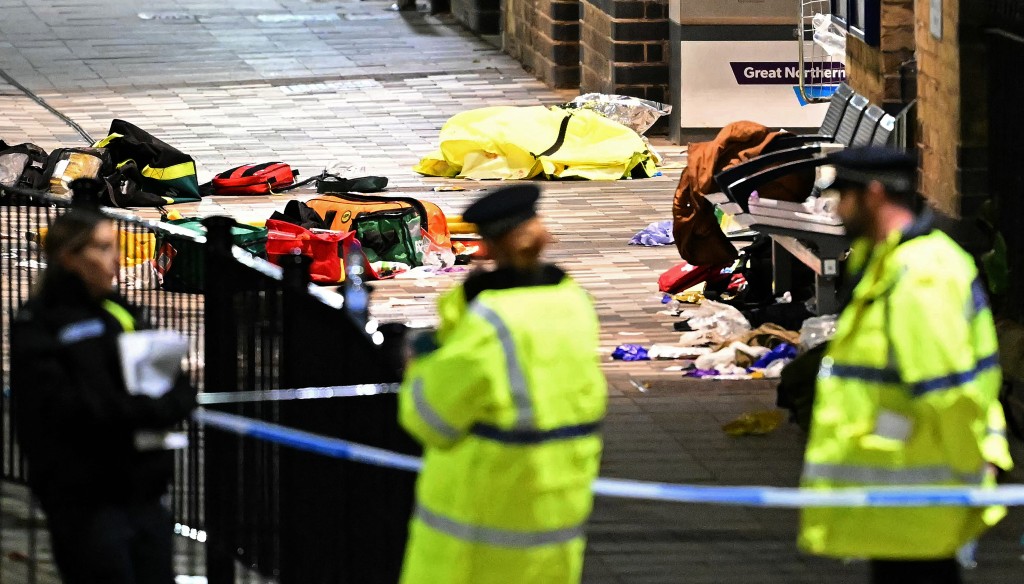 Paramedics medical equipment is pictured in side a police cordon outside Huntingdon Station in Huntingdon, eastern England, on November 1, 2025, following a stabbing on a train. (AFP)