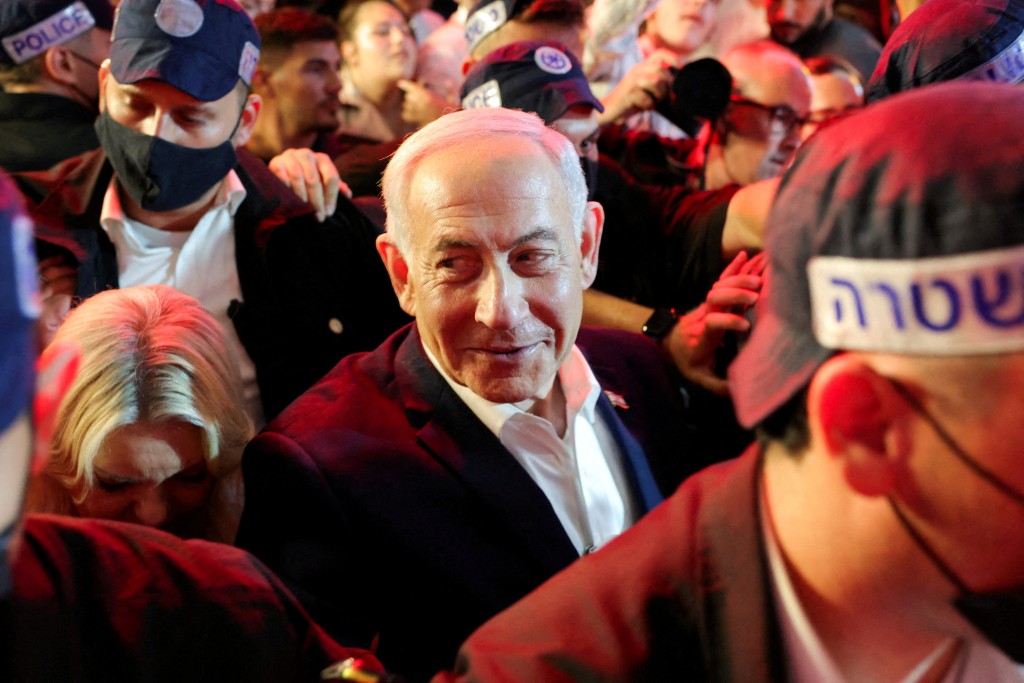 FILE PHOTO: Israeli Prime Minister Benjamin Netanyahu, leader of the Likud party, reacts as he tours the Mahane Yehuda market, ahead of Israel's national election, in Jerusalem, October 23, 2026. REUTERS/Kevin Coombs/File Photo
