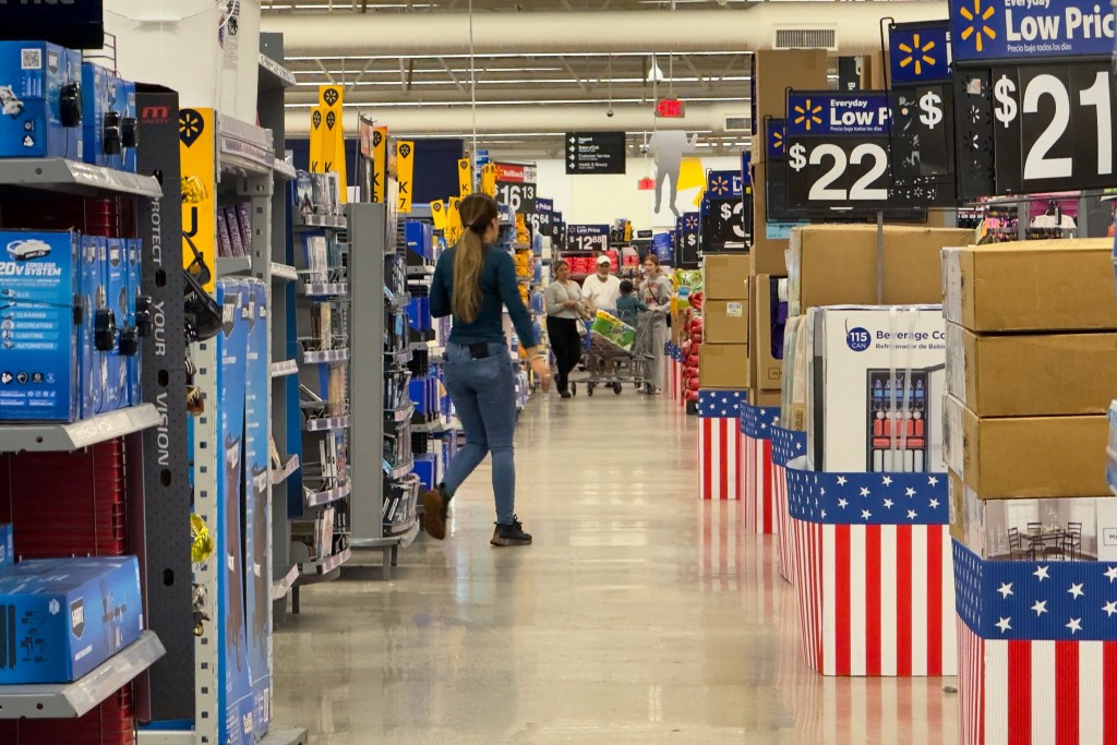 People walk at a Walmart store in California in the US. Reuters.