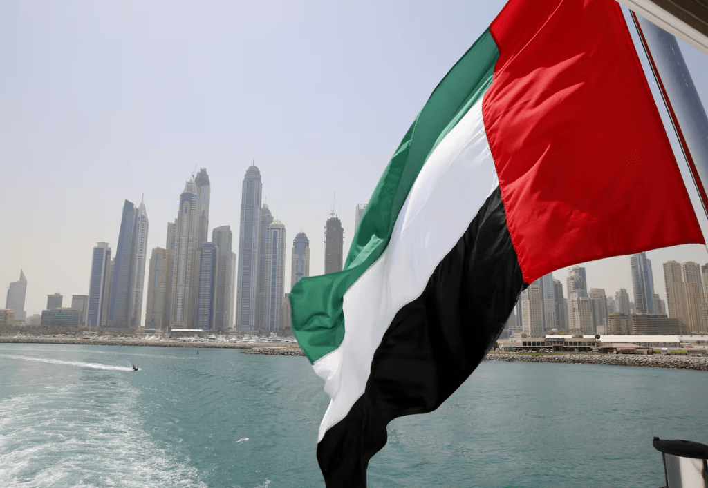 UAE flag flies over a boat at Dubai Marina, Dubai, United Arab Emirates May 22, 2015. REUTERS/Ahmed Jadallah
