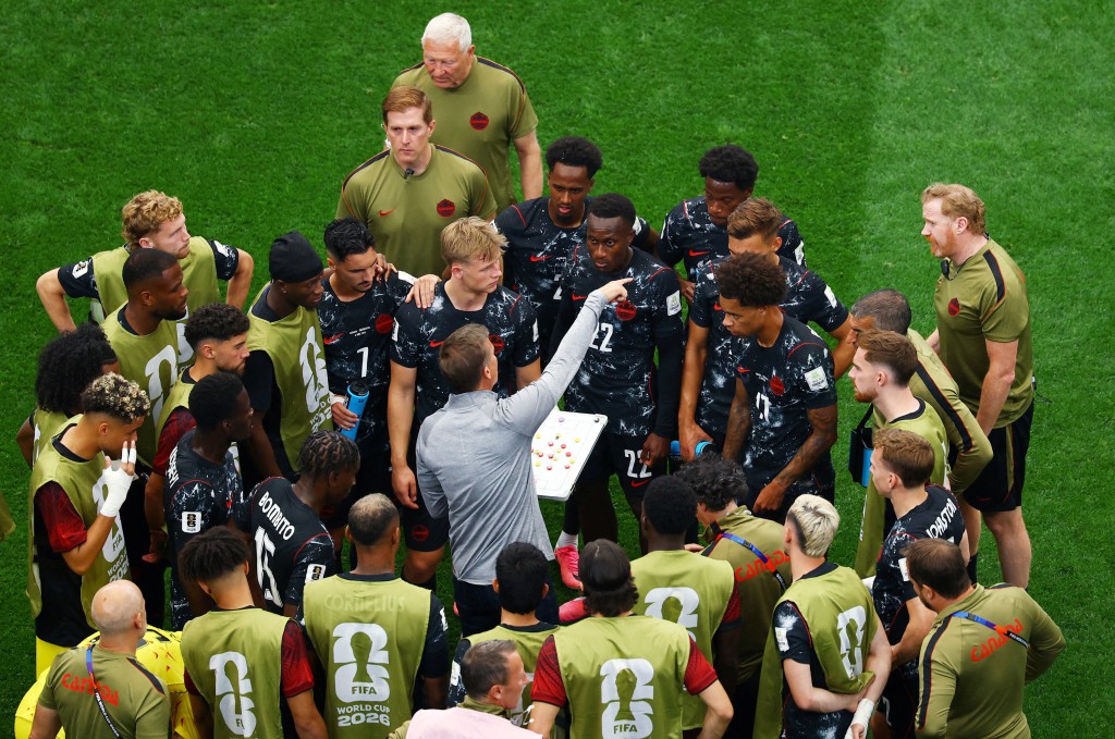 Canada coach Jesse Marsch gives instructions to players during a hydration break. (Reuters)