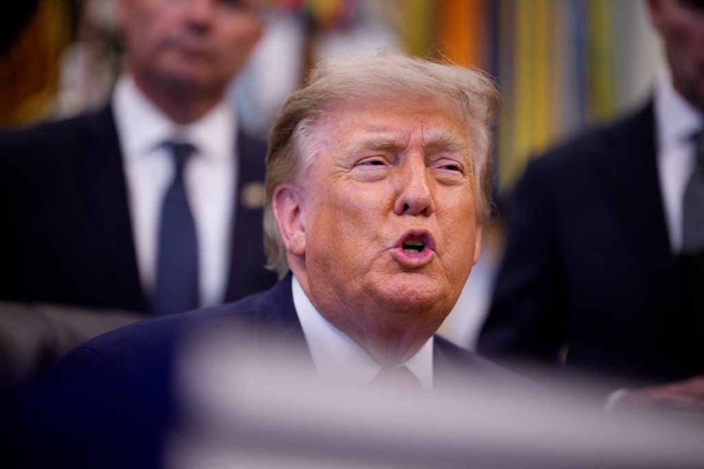  U.S. President Donald Trump speaks to members of the media during an executive order signing in the Oval Office of the White House on July 13, 2026 in Washington, DC. Trump signed two executive orders related to the transfer of federal land to the State of Utah. Andrew Harnik/Getty Images/AFP
