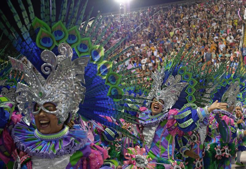 Members of Mangueira samba school perform during the first night carnival parade at the Marques de Sapucai Sambadrome in Rio de Janeiro, Brazil. (AFP) Members of Mangueira samba school perform during the first night carnival parade at the Marques de Sapucai Sambadrome in Rio de Janeiro, Brazil. (AFP)