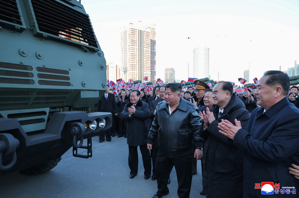 This picture taken on February 18, 2026 and released by North Korea's official Korean Central News Agency (KCNA) on February 19, 2026 shows North Korean leader Kim Jong Un (C) attending a ceremony to unveil the new 600mm multiple launch rocket system in front of the April 25th Cultural Center in Pyongyang. (Photo by KCNA VIA KNS / AFP)