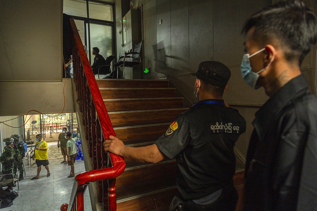 Photo by STR / AFP  Members of the Karen Border Guard Force (BGF) carry out an inspection at a work place during a crackdown operation on illicit activity linked to scam centres in Shwe Kokko in Myanmar's eastern Myawaddy township on February 18, 2025.