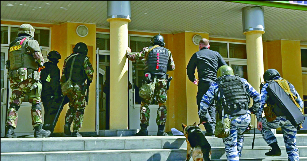 Police special units respond to the shooting at School No 175 in Kazan. AFP, AP Police special units respond to the shooting at School No 175 in Kazan. AFP, AP