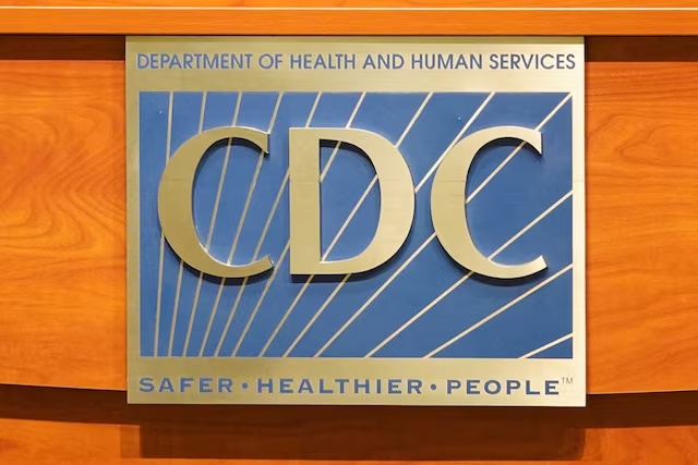 FILE PHOTO: A sign of the Centers for Disease Control and Prevention is seen on a podium during the meeting of the members of the Advisory Committee on Immunization Practices, in Atlanta, Georgia, U.S. June 25, 2025.  REUTERS/Megan Varner/File Photo/File Photo 