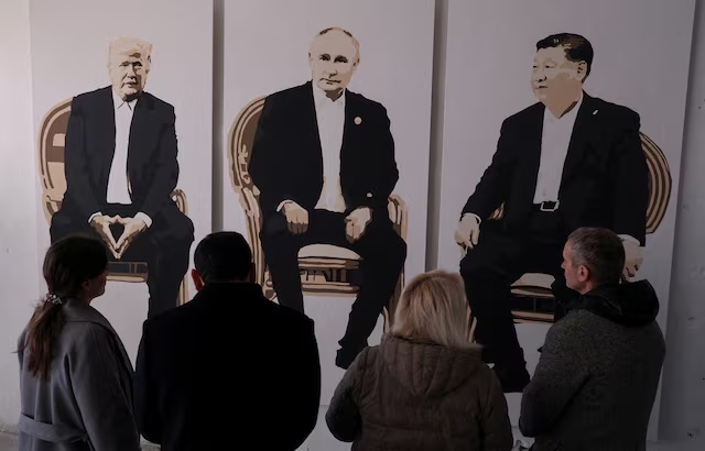 Visitors stand in front of an artwork depicting U.S. President Donald Trump, Russian President Vladimir Putin and Chinese President Xi Jinping at an exhibition, which is called "Yalta 2.0" and opened to make a reference to the 1945 Yalta Conference, at an art gallery in Livadia park in Yalta, Crimea, February 8, 2025. REUTERS/Alexey Pavlishak