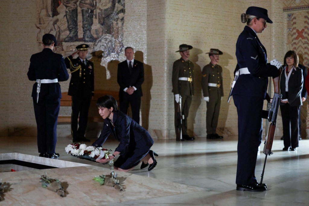 Japan's Prime Minister Sanae Takaichi lays a wreath on the Tomb of the Unknown Australian Soldier, in Canberra, Australia, May 4, 2026. (Reuters)