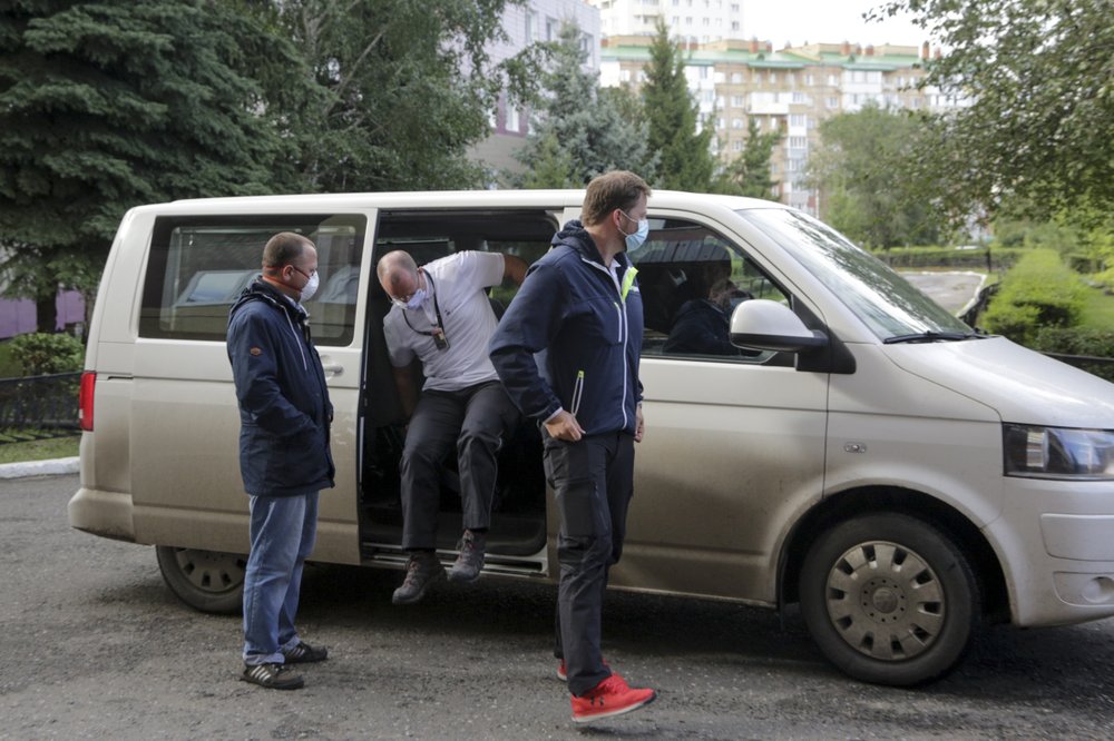 German medics arrive at the Omsk Ambulance Hospital No. 1, intensive care unit where Alexei Navalny was hospitalized in Omsk, Russia, Friday.
