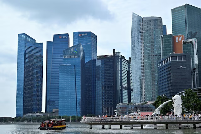 A view of the Merlion against the Singapore financial district in Singapore, January 27, 2023. REUTERS/Caroline Chia 