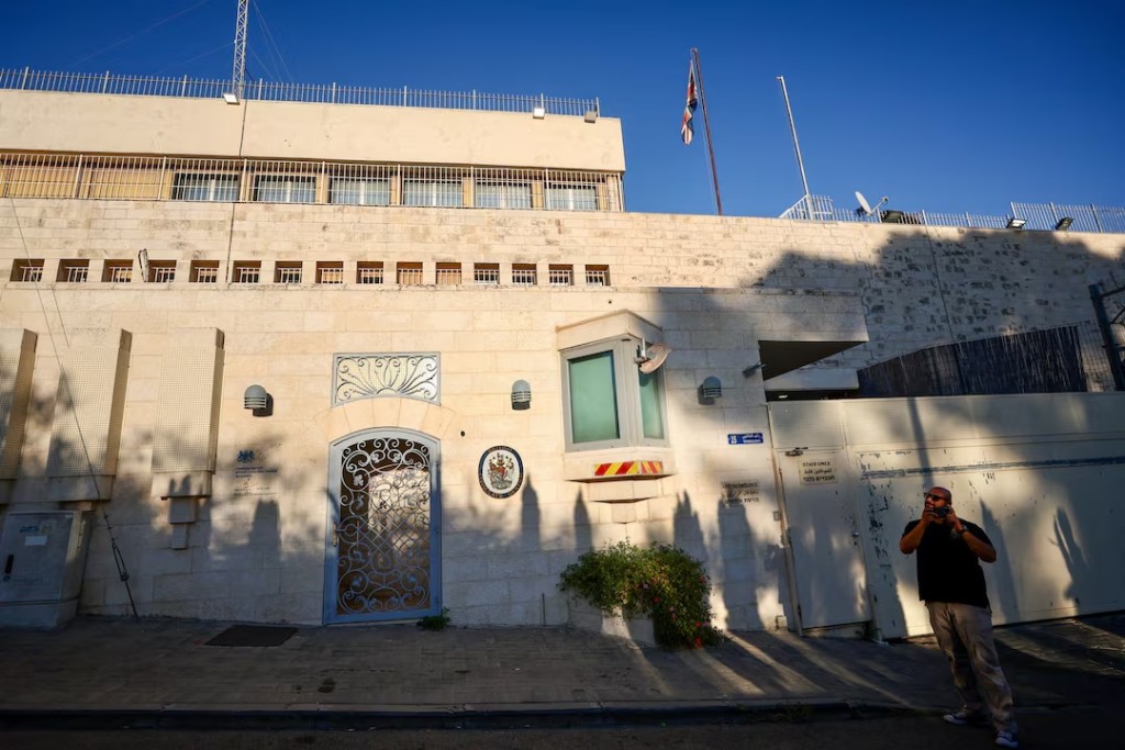 A person stands outside the British Consulate, on the day Israeli Foreign Minister Gideon Saar said he would close it in response to trade sanctions imposed by British Prime Minister Andy Burnham against Israeli settlements in the occupied West Bank, in Jerusalem, September 8, 2026. REUTERS/Jamal Awad 