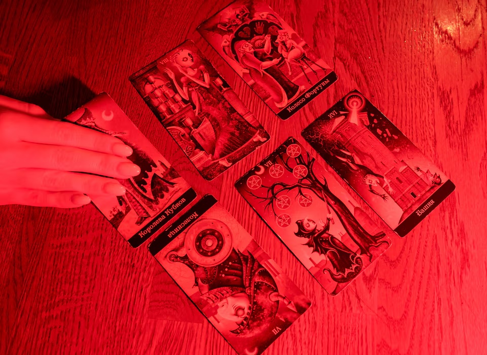 Fortune teller Arina Frants lays out Tarot cards on a table in the voodoo-themed bar Marie Laveau in Moscow, Russia, February 17, 2026. REUTERS/Shamil Zhumatov