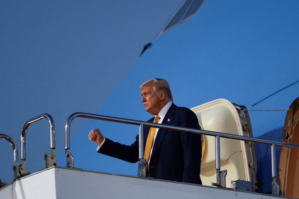 U.S. President Donald Trump gestures as he disembarks Air Force One at Haneda Airport in Tokyo, Japan, for the second stop on his Asia tour, October 27, 2025. (Reuters)