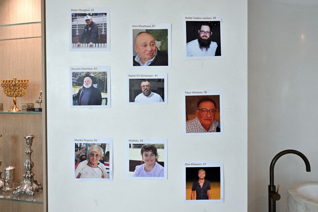 Photographs of the victims of a mass shooting during a Jewish Hanukkah celebration on Sydney's Bondi Beach on Sunday are displayed at Chabad of Bondi Synagogue after the funeral of Rabbi Eli Schlanger, in Sydney, Australia, December 17, 2025. AAP/Mick Tsikas/via REUTERS