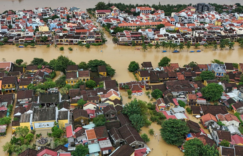 This aerial picture shows floodwaters inundating streets and buildings following heavy rains in Hoi An on October 30, 2025. (AFP)
