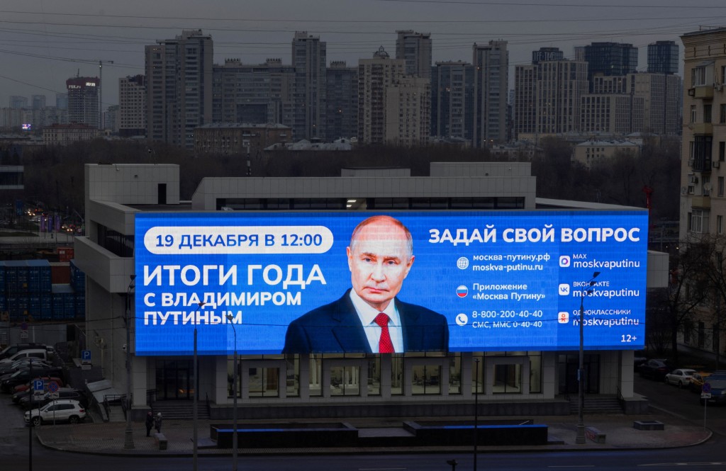 A digital screen mounted on a building facade promotes the upcoming annual year-end televised phone-in and press conference of Russian President Vladimir Putin in Moscow, Russia, December 18, 2025. REUTERS/Ramil Sitdikov