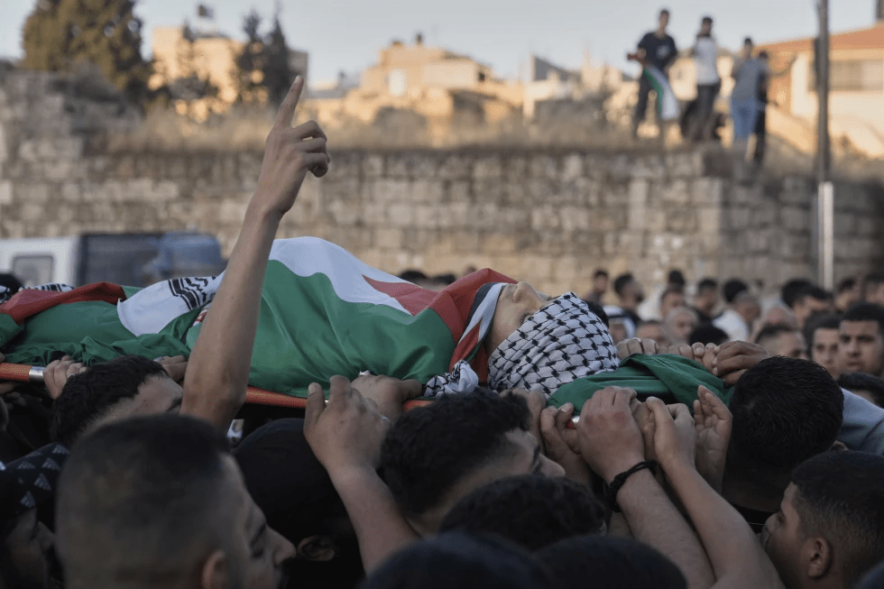 Palestinians carry the body of Abdul Khaleq Jbour, 16, who was killed in an Israeli military raid, during his funeral at the West Bank village of Salem, near Nablus, Friday, April 25, 2025. (AP Photo/Majdi Mohammed)