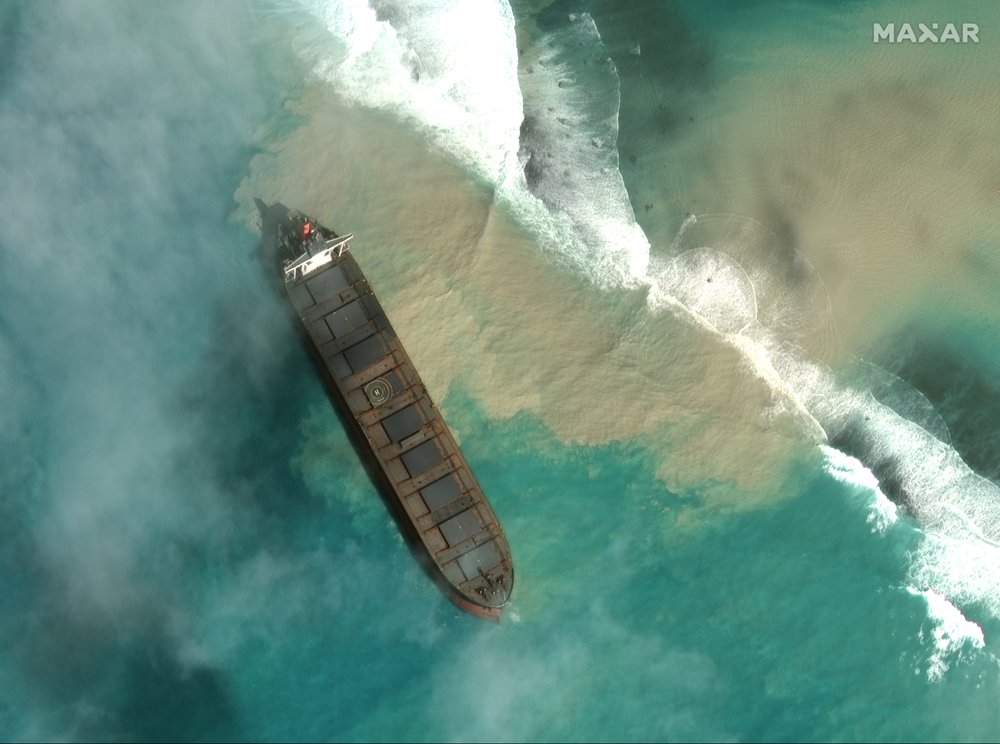 In this satellite image provided by 2020 Maxar Technologies on Friday, Aug. 7, 2020, an aerial view of the MV Wakashio, a bulk carrier ship that recently ran aground off the southeast coast of Mauritius. In this satellite image provided by 2020 Maxar Technologies on Friday, Aug. 7, 2020, an aerial view of the MV Wakashio, a bulk carrier ship that recently ran aground off the southeast coast of Mauritius.