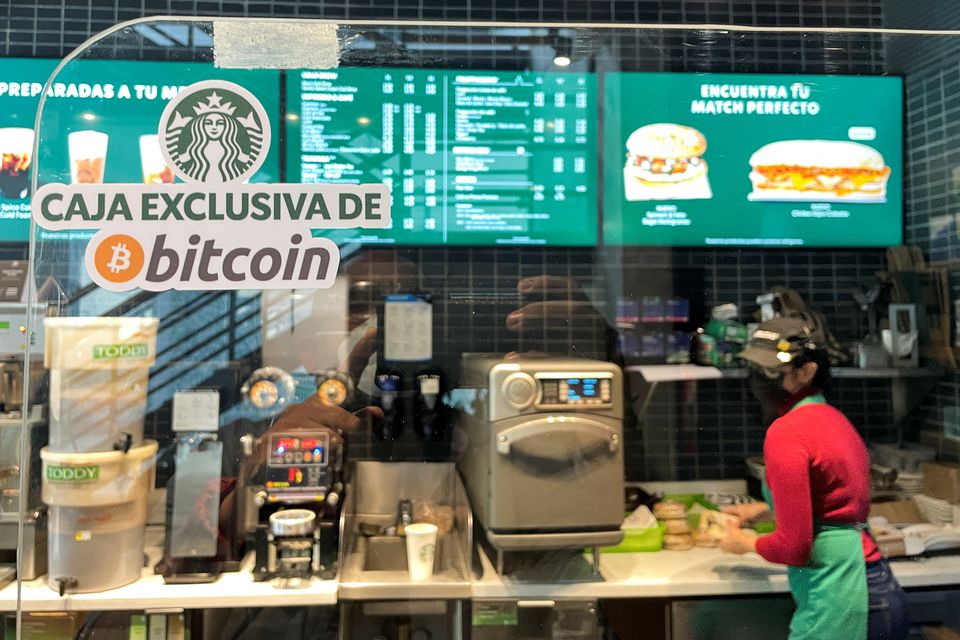 A sign reads: 'Exclusive Bitcoin register' in a Starbucks store where the cryptocurrency is accepted as a payment method, in San Salvador, El Salvador. A sign reads: 'Exclusive Bitcoin register' in a Starbucks store where the cryptocurrency is accepted as a payment method, in San Salvador, El Salvador.