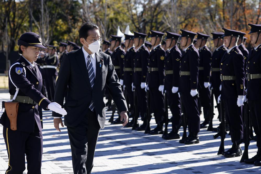 Japan's Prime Minister Fumio Kishida, second left, reviews an honor guard at the Japan Ground Self-Defense Force Camp Asaka in Tokyo, Japan. (AP) Japan's Prime Minister Fumio Kishida, second left, reviews an honor guard at the Japan Ground Self-Defense Force Camp Asaka in Tokyo, Japan. (AP)