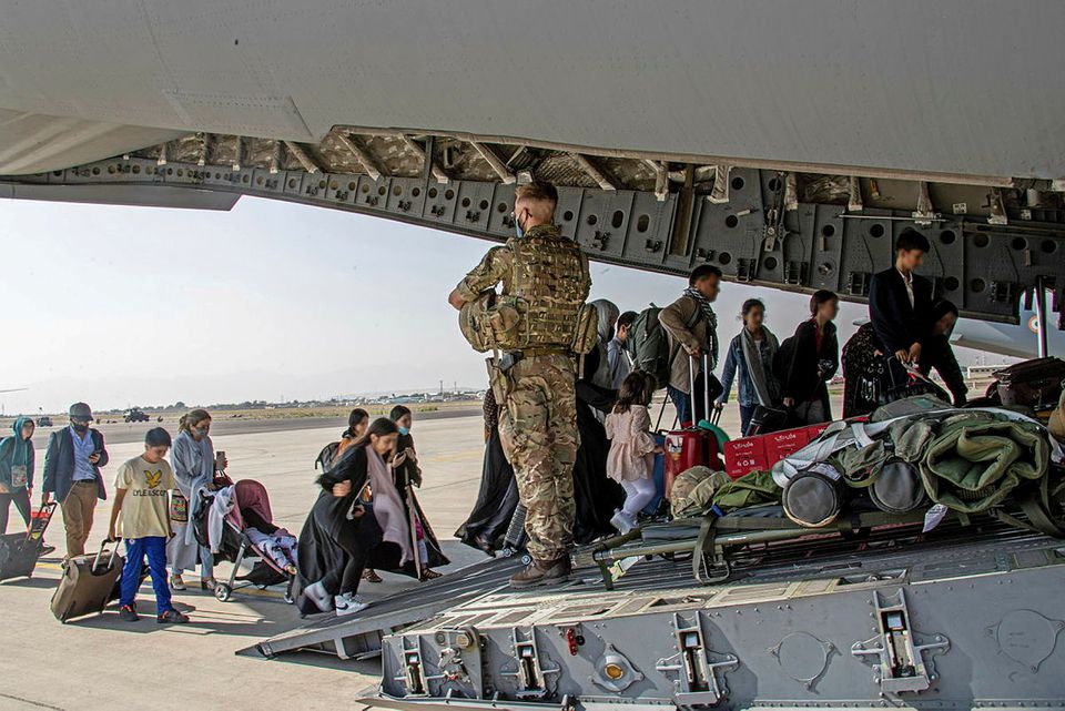 British citizens and dual nationals residing in Afghanistan board a military plane for evacuation from Kabul airport. British citizens and dual nationals residing in Afghanistan board a military plane for evacuation from Kabul airport.