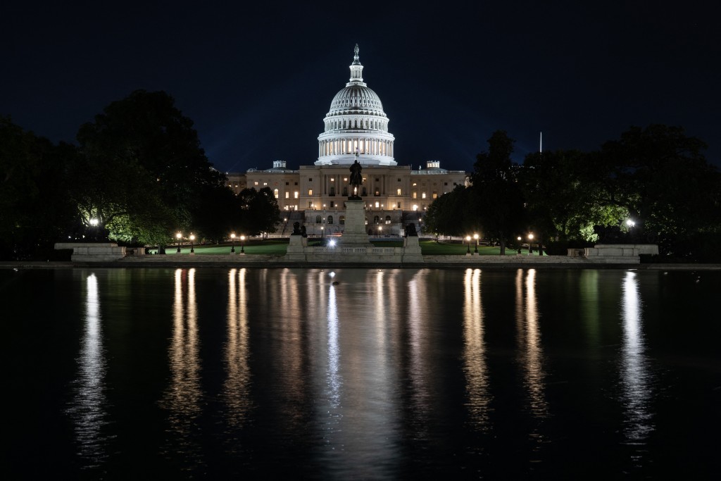 The US Capitol is seen lit up hours before a partial government shutdown is set to take effect in Washington, DC, on September 30, 2025. The US government barreled towards its first shutdown in six years Tuesday, with funding expiring at midnight after Democrats fought a war of words with Donald Trump and senators rejected a last-ditch bid to keep the lights on. (Photo by ANDREW CABALLERO-REYNOLDS / AFP)