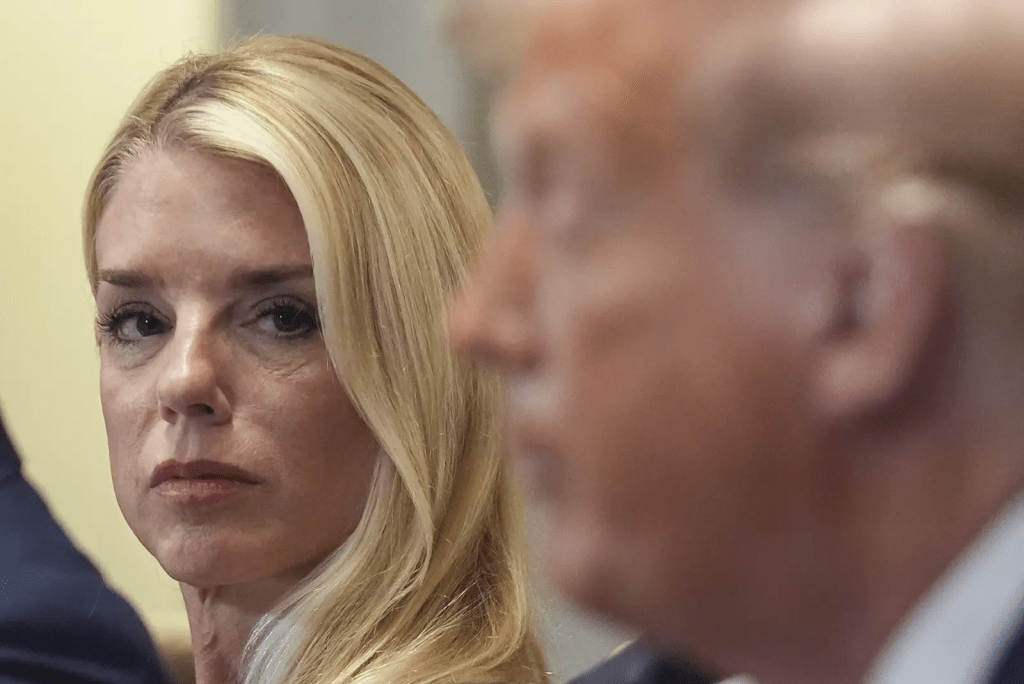 Attorney General Pam Bondi, left, listens as President Donald Trump, right, speaks during a cabinet meeting at the White House, Tuesday, July 8, 2025, in Washington. (AP Photo/Evan Vucci)