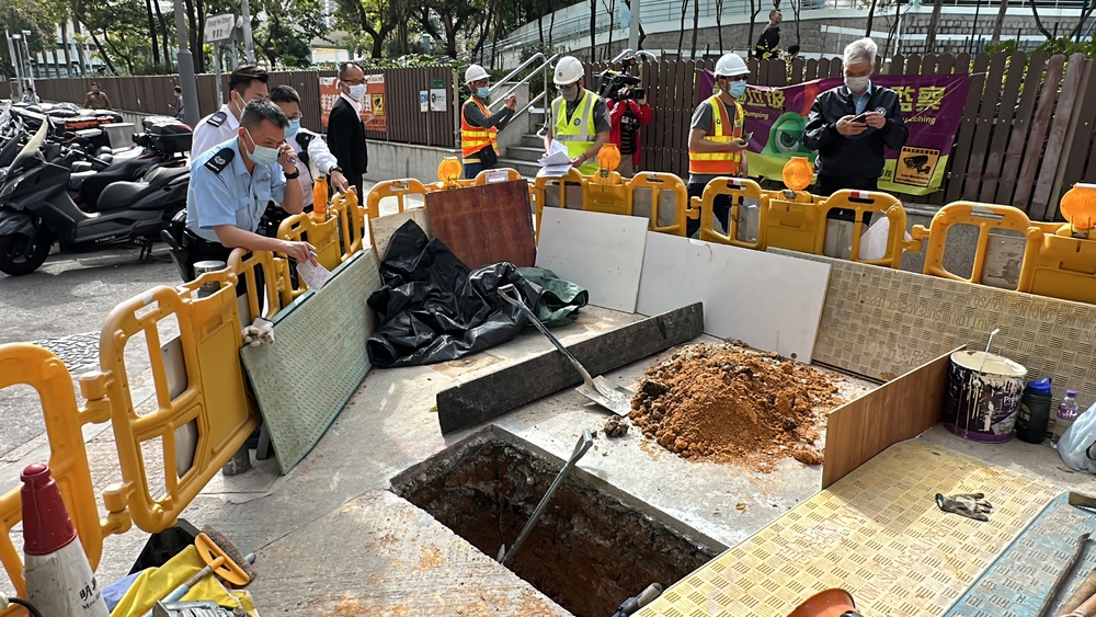 The seriousness of construction-site accidents hit home with, left, one of two workers, later declared dead, being taken to hospital from a West Kowloon project in late September and, right, police officers looking at where a worker in San Po Kong hi The seriousness of construction-site accidents hit home with, left, one of two workers, later declared dead, being taken to hospital from a West Kowloon project in late September and, right, police officers looking at where a worker in San Po Kong hi