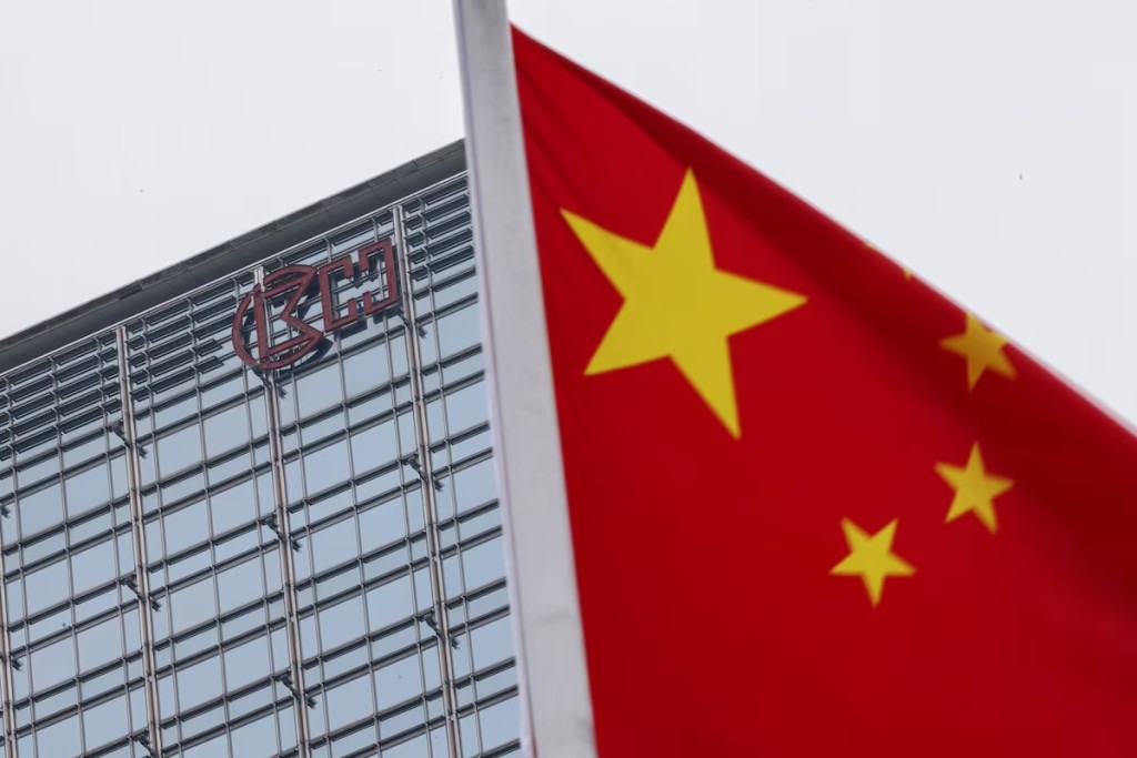 A Chinese national flag flutters in the wind with the Cheung Kong Center building and CK Hutchison logo in the background in Hong Kong, China, April 1, 2025. REUTERS